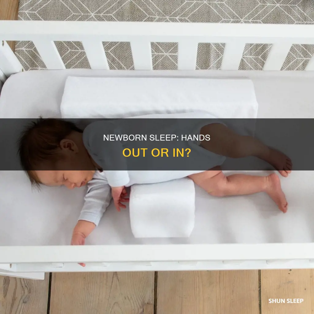 can newborn sleep with hands out