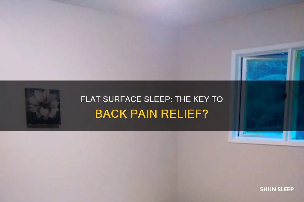 does sleeping on a flat surface help your back