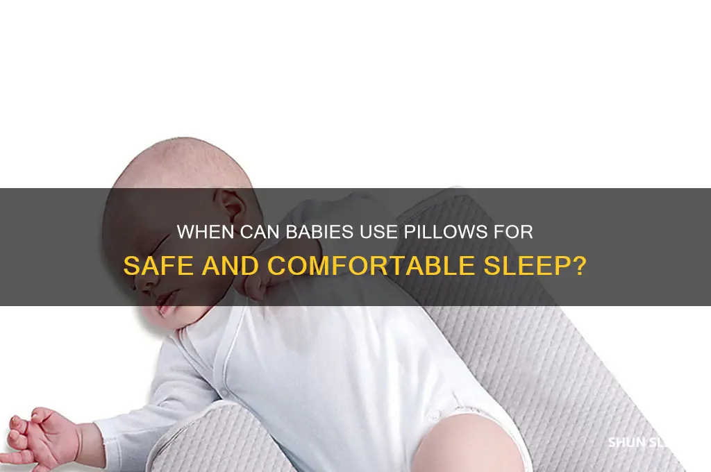 how soon can a baby sleep with a pillow
