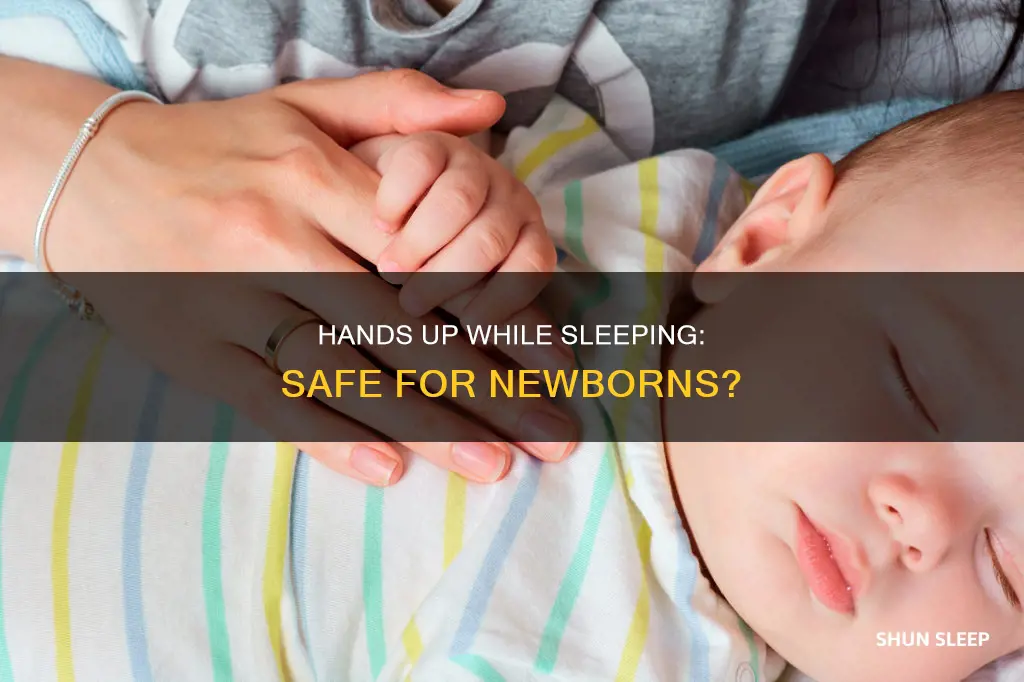 is it ok for newborn to sleep with hands up