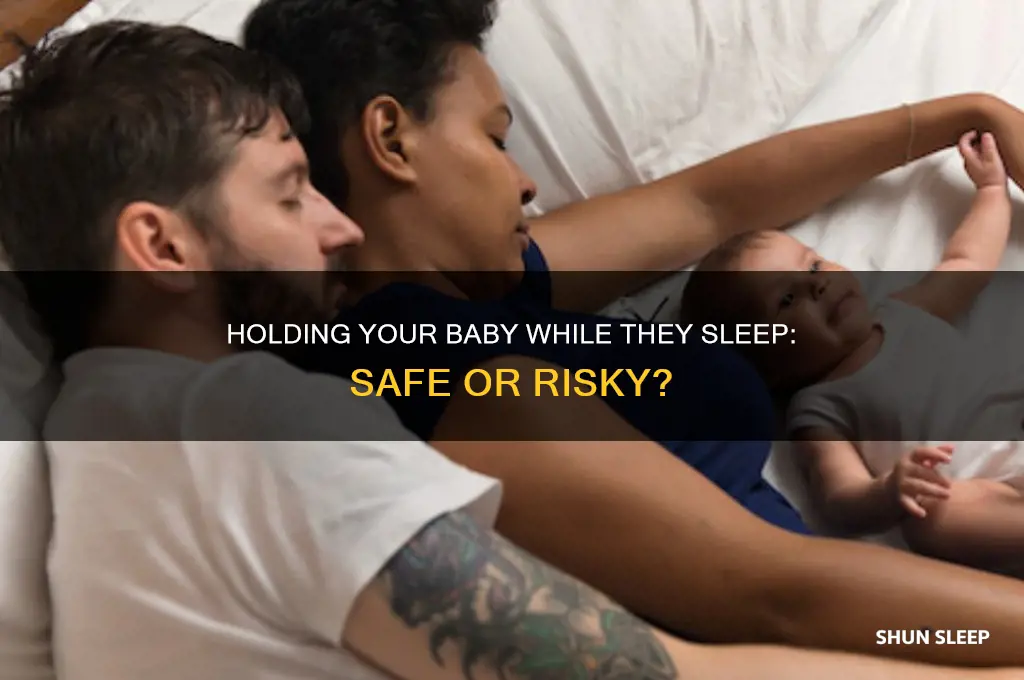 is it ok to hold my baby while she sleeps