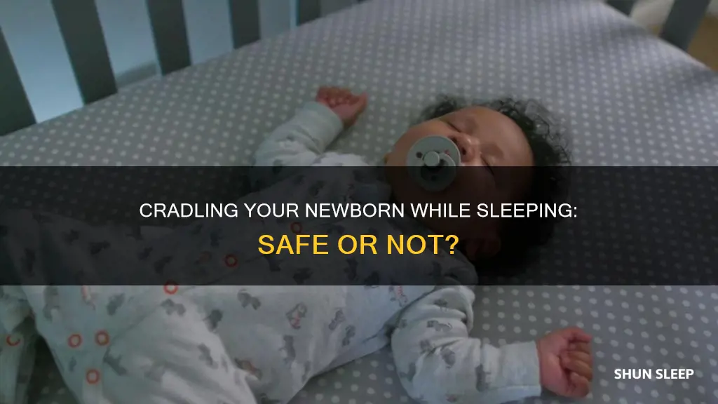 is it ok to hold my newborn while sleeping