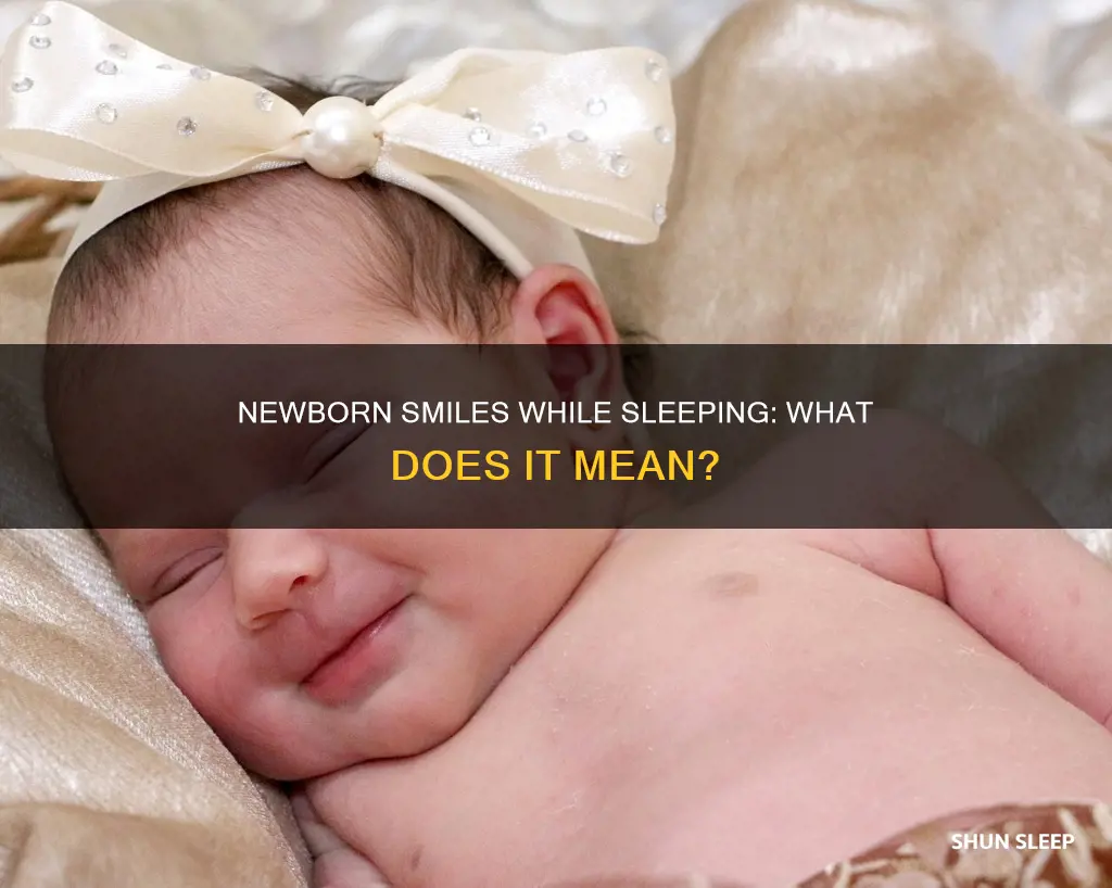 what does it mean when newborn smiles in sleep