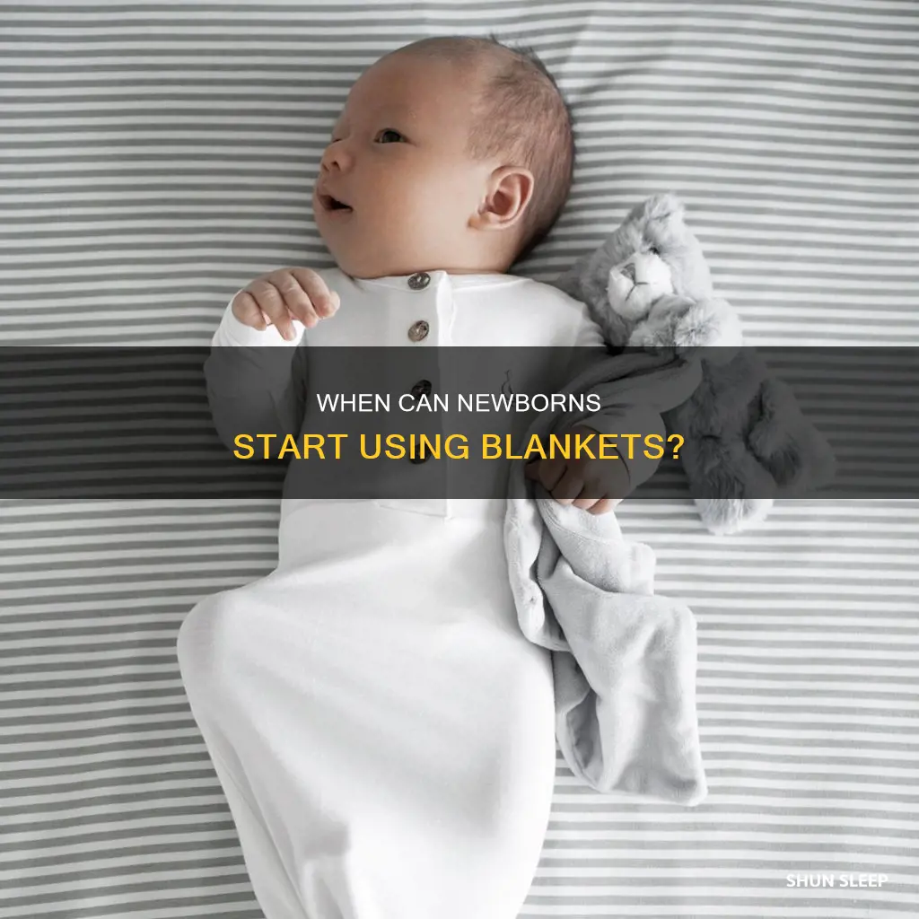 when can a newborn sleep with a blanket