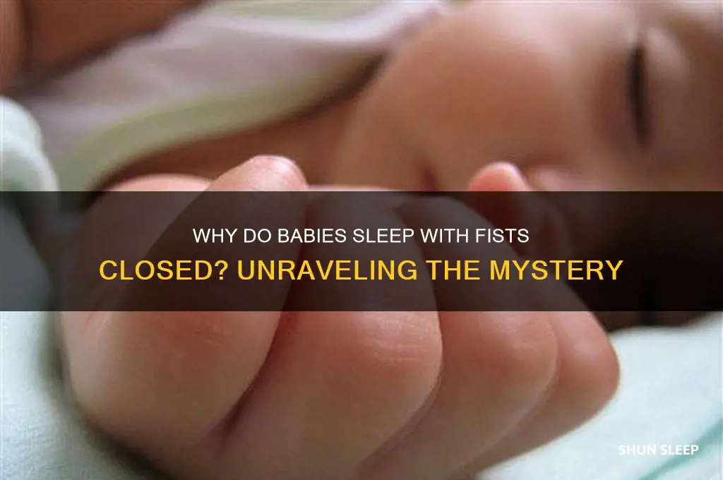 why do babies sleep with fist closed