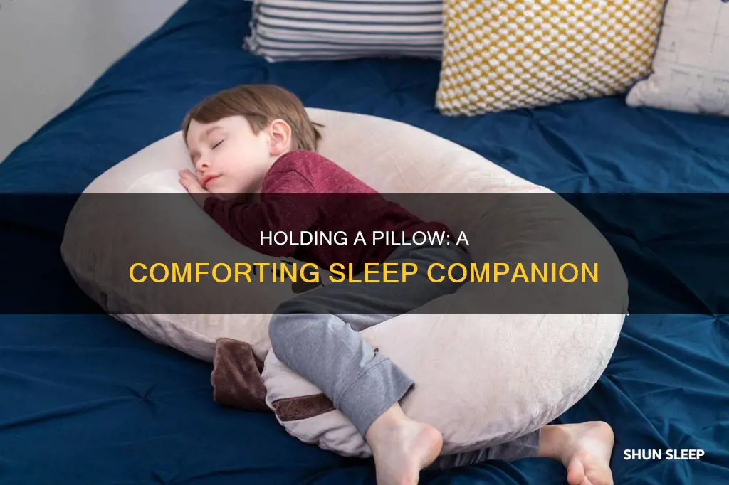 why do i sleep better holding a pillow