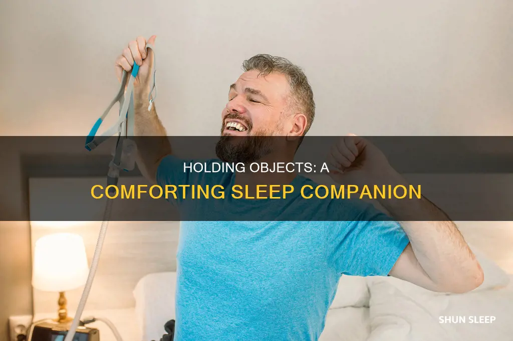why do i sleep better holding something