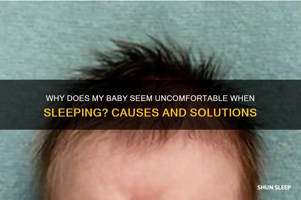 why does my baby seem uncomfortable when sleeping