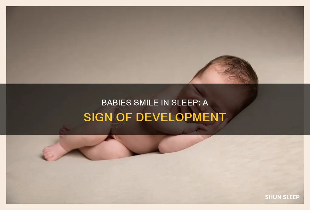 why does my one month old smile in her sleep