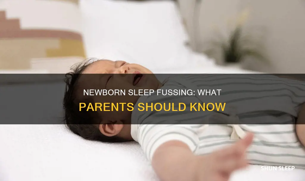 why is my newborn fussing in her sleep