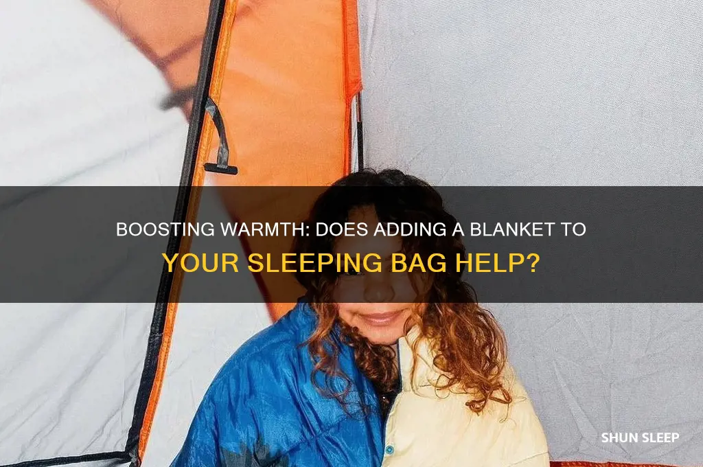 will adding a blanket to sleeping bag help keep warm